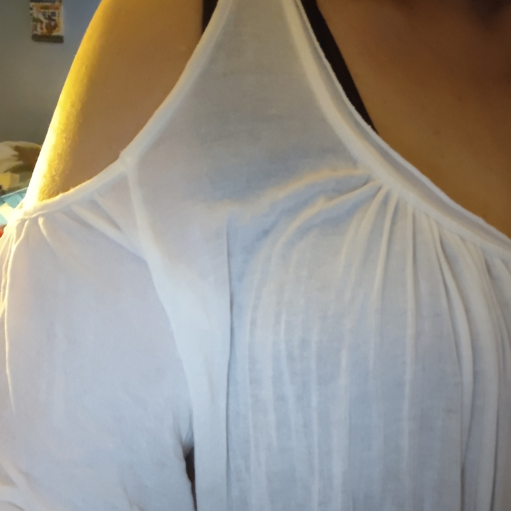 White pleated top.  Cold shoulder, and low neck lines. Great as a beach cover up